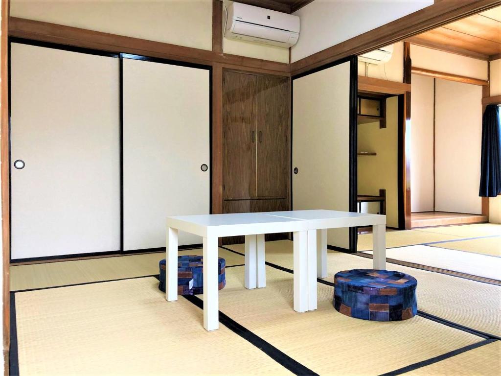 Postel nebo postele na pokoji v ubytování Guesthouse YadoyaDOYA