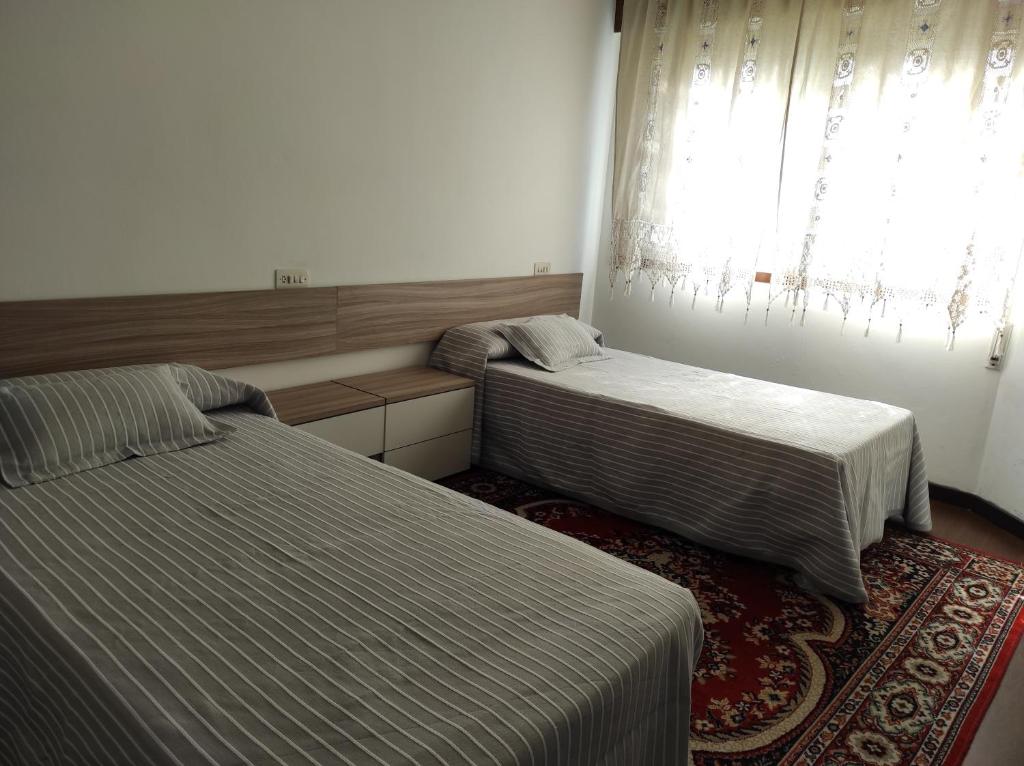 A bed or beds in a room at Piso cangas