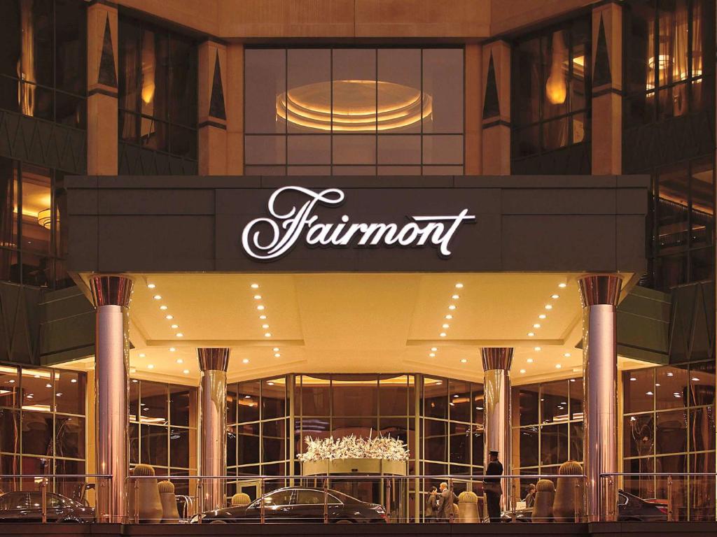 
a large building with a clock on the front of it at Fairmont Nile City in Cairo
