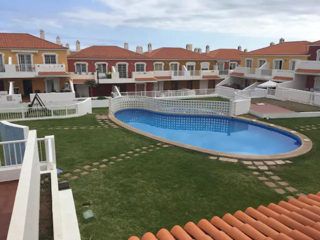 ariaal uitzicht op een tuin met een zwembad bij 124 PORIS DE ABONA Holiday Home by Sunkeyrents in Santa Cruz de Tenerife
