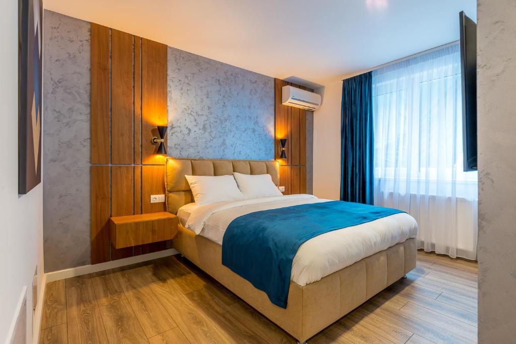 Postel nebo postele na pokoji v ubytování SarmiHouse