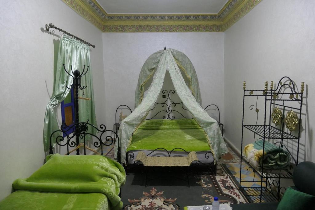 Letto o letti in una camera di Riad Maryam Taroudant