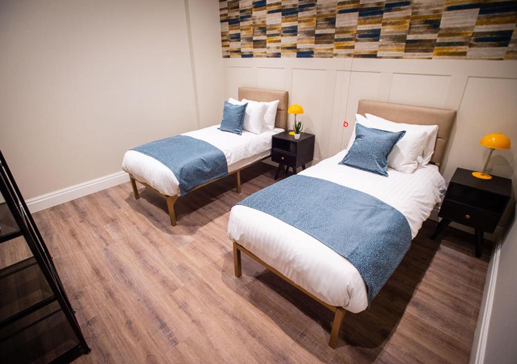 Postel nebo postele na pokoji v ubytování The Gresham Aparthotel