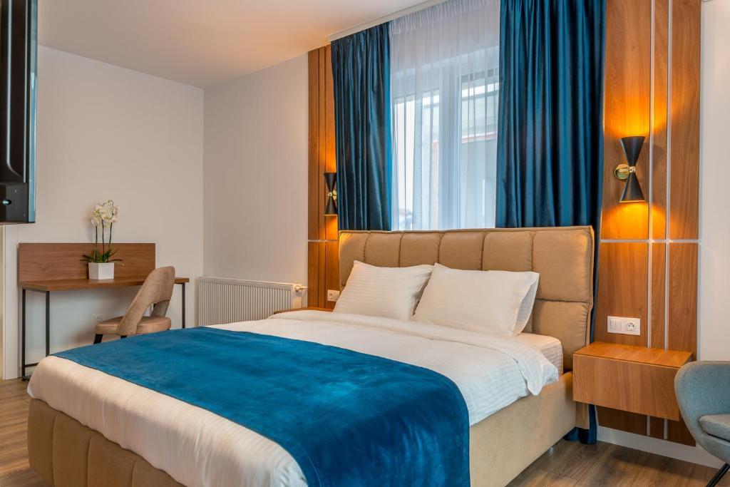 Postel nebo postele na pokoji v ubytování SarmiHouse