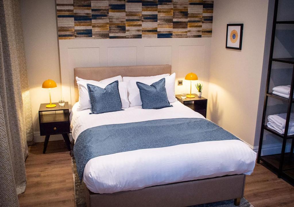 Postel nebo postele na pokoji v ubytování The Gresham Aparthotel