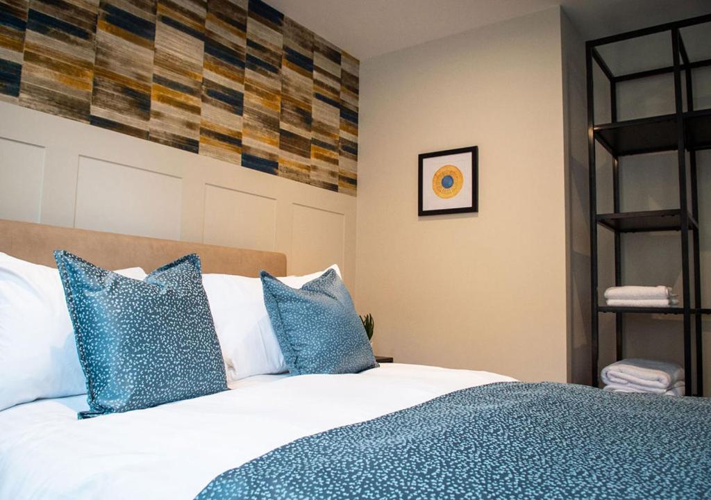 Postel nebo postele na pokoji v ubytování The Gresham Aparthotel
