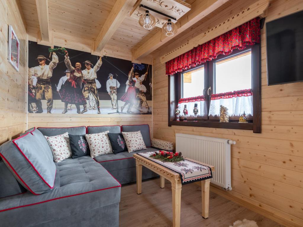 Televízia a/alebo spoločenská miestnosť v ubytovaní Domek Góralska Nuta