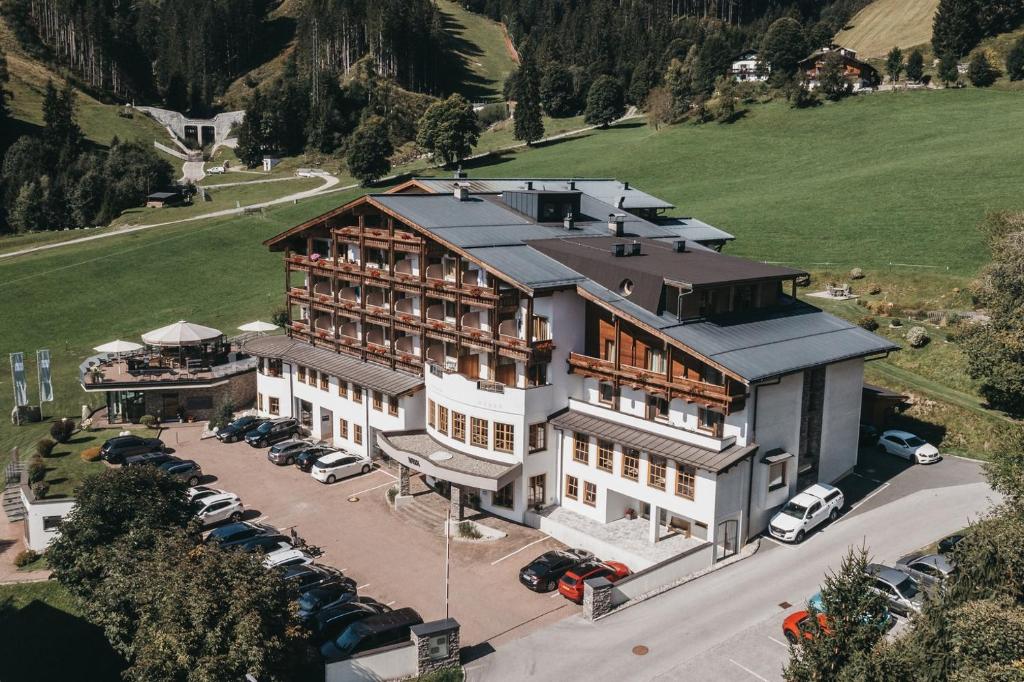 an aerial view of a large building with a parking lot at VAYA Zell am See in Zell am See