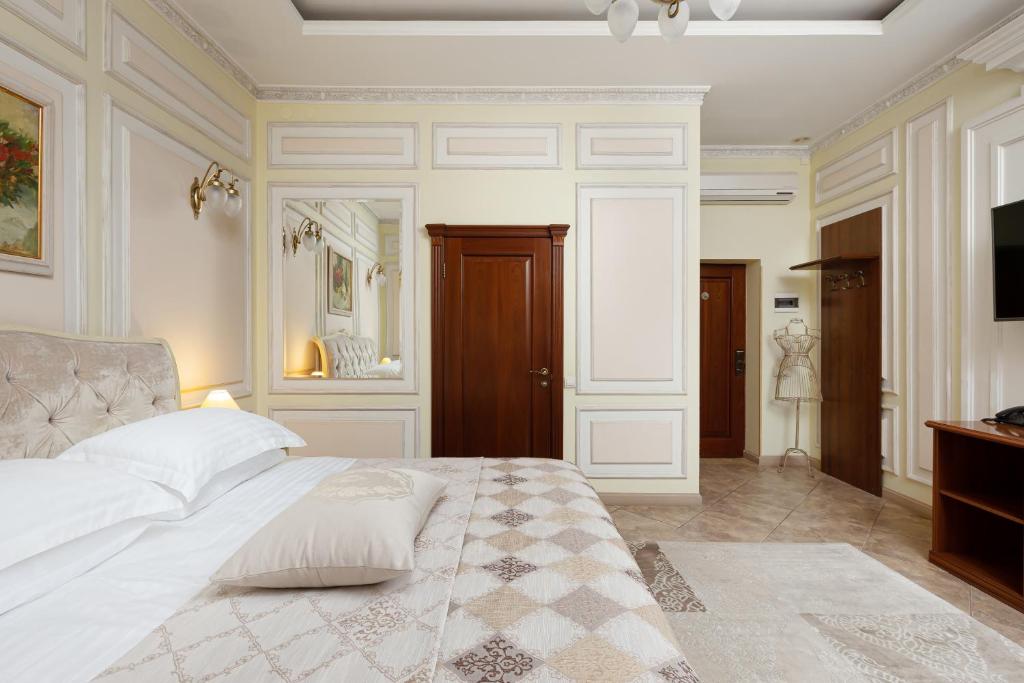 Postel nebo postele na pokoji v ubytování Chopin Hotel