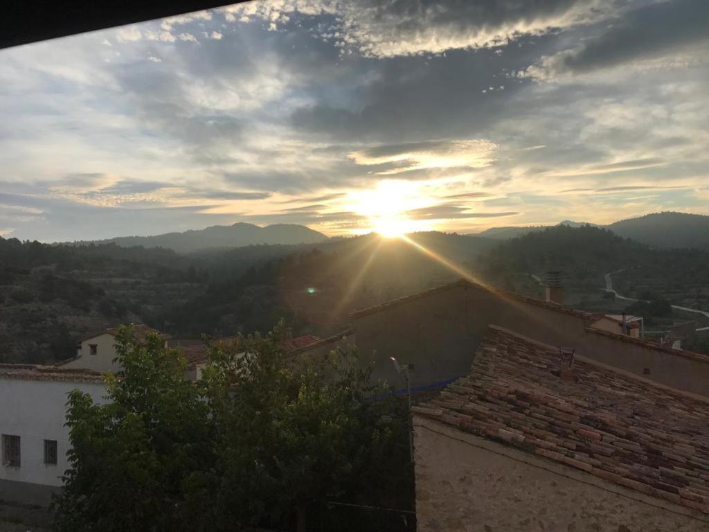 a view of the sun setting over a city at Casa Rural cerca de Morella in Zorita del Maestrazgo