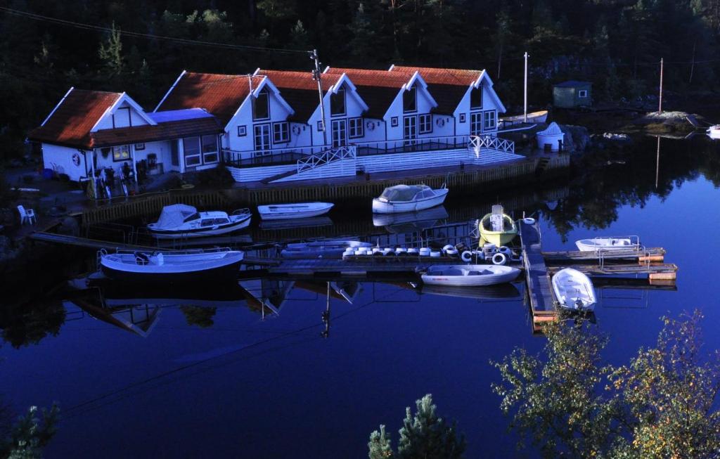 a group of boats are docked in a marina at Aasheim Rorbuer in Bømlo