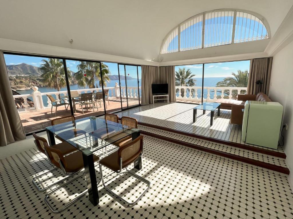 a living room with a view of the ocean at Hotel Paraíso Del Mar in Nerja