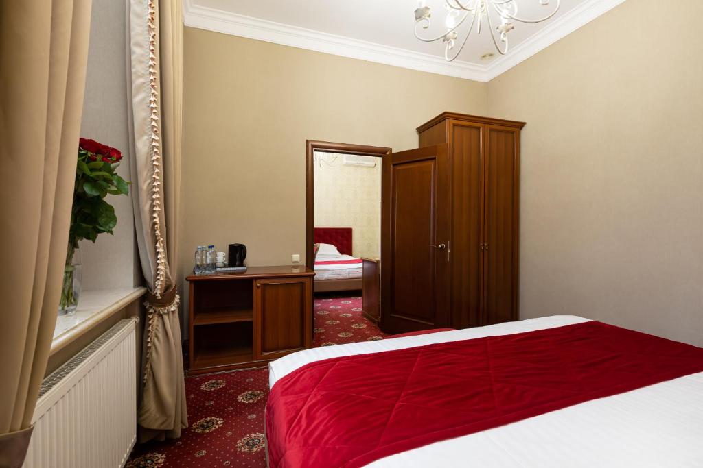 Postel nebo postele na pokoji v ubytování Chopin Hotel