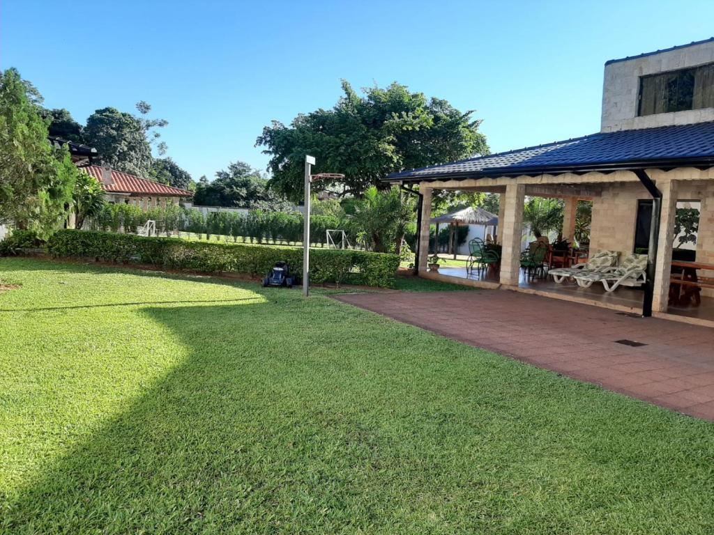 a large yard with a pavilion and a patio at Quinta Jardin in San Lorenzo de la Frontera