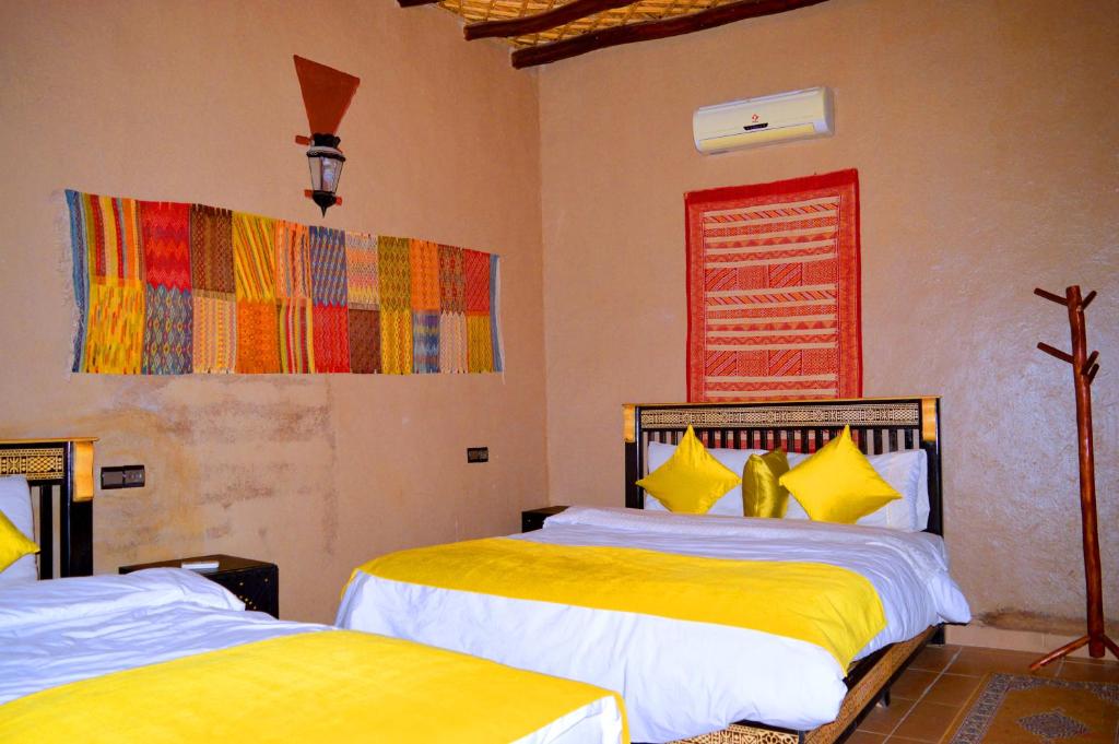 Postel nebo postele na pokoji v ubytování Auberge Les Roches