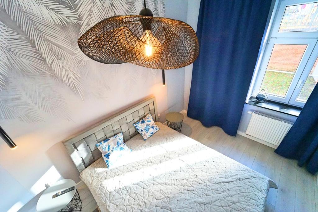 Posteľ alebo postele v izbe v ubytovaní Apartamenty EverySky - Mickiewicza 30