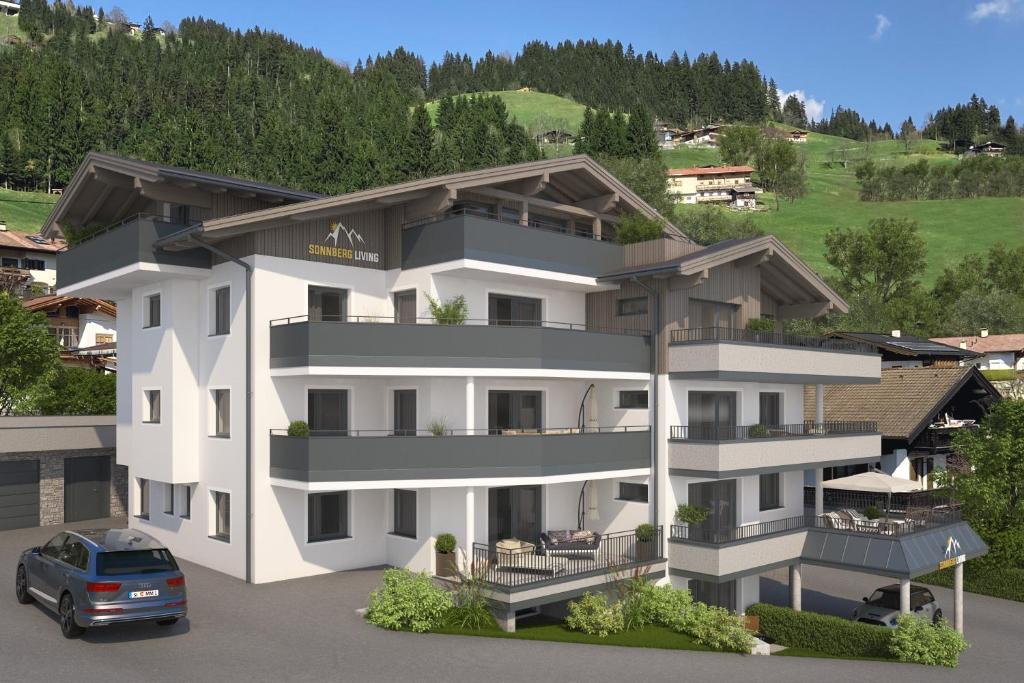 uma representação de um edifício de apartamentos branco em Das Neue Sonnberg Living, SKI IN-SKI OUT em Brixen im Thale