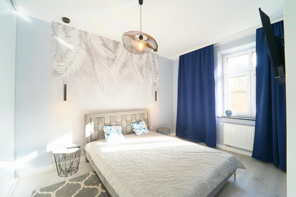 Posteľ alebo postele v izbe v ubytovaní Apartamenty EverySky - Mickiewicza 30