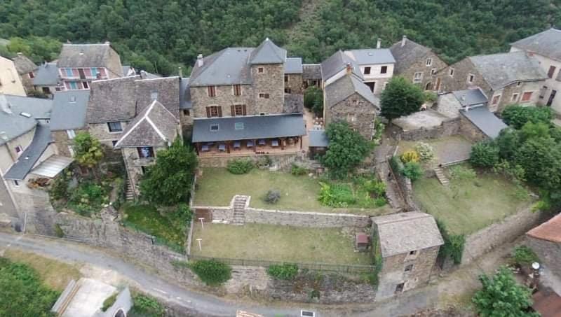 an aerial view of a large house with a yard at Gîte du Presbytère in Ayssènes-la-Bacaresse