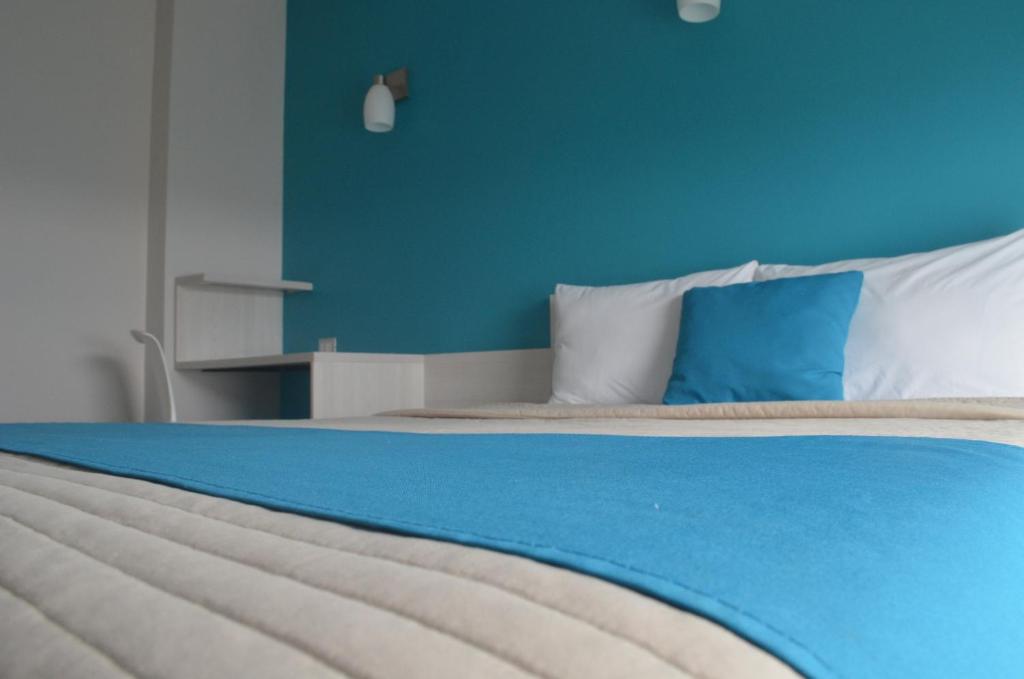 Postel nebo postele na pokoji v ubytování SC HOTEL