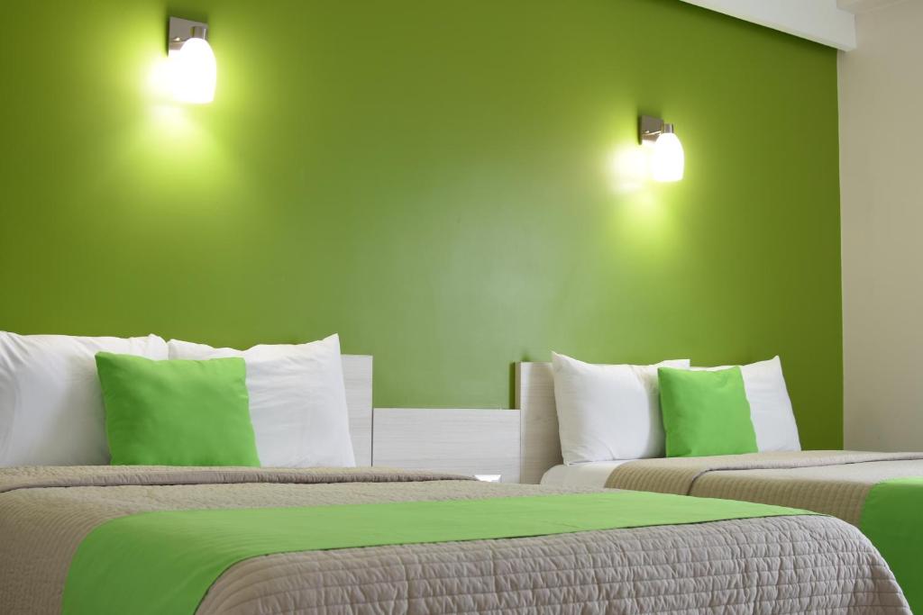 Postel nebo postele na pokoji v ubytování SC HOTEL