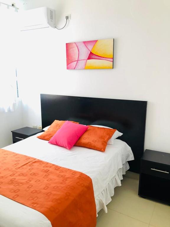 Postel nebo postele na pokoji v ubytování Valdivia Suites