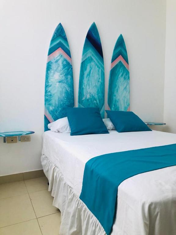 Postel nebo postele na pokoji v ubytování Valdivia Suites