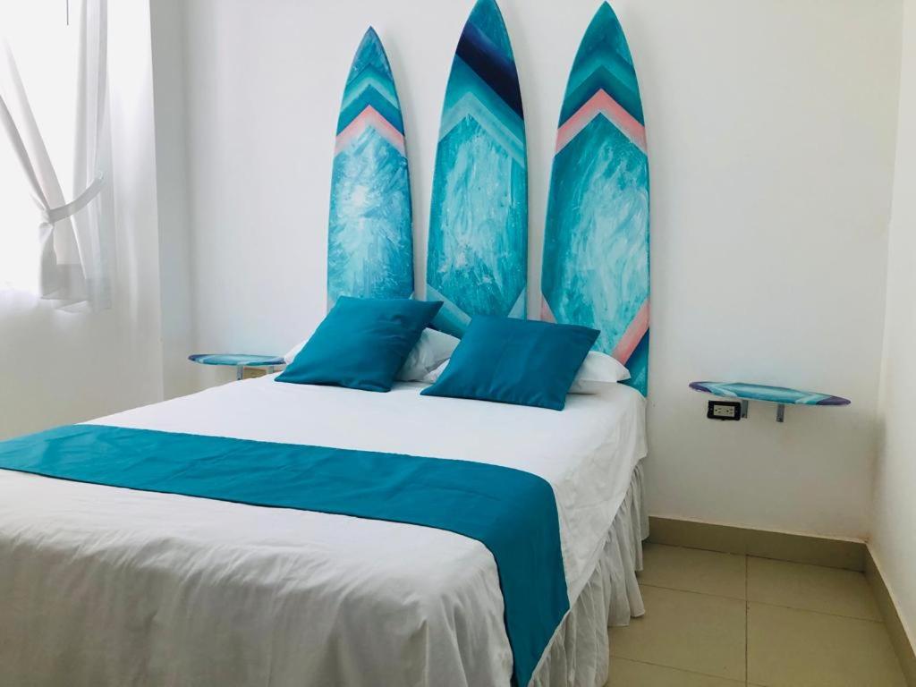 Postel nebo postele na pokoji v ubytování Valdivia Suites