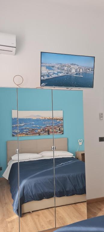 A bed or beds in a room at Napoli Blu Gardenia B&B