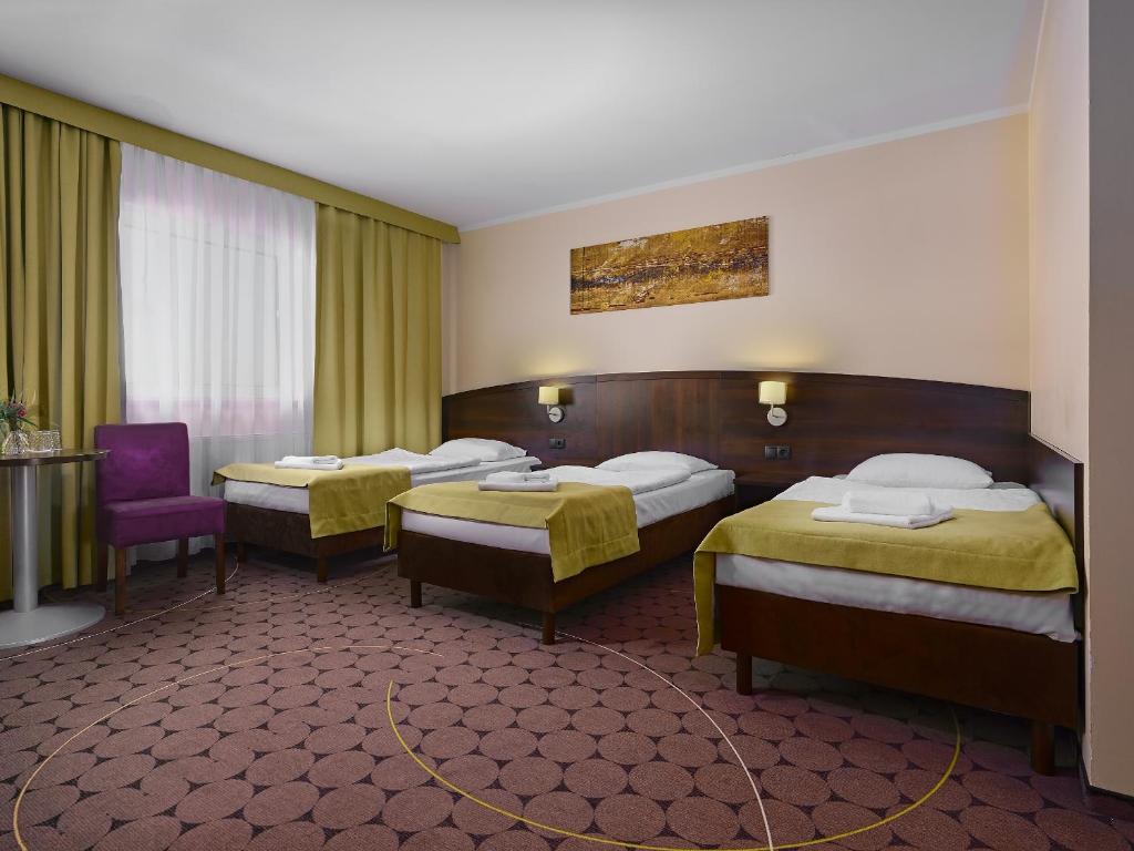 Posteľ alebo postele v izbe v ubytovaní Aparthotel Lumen