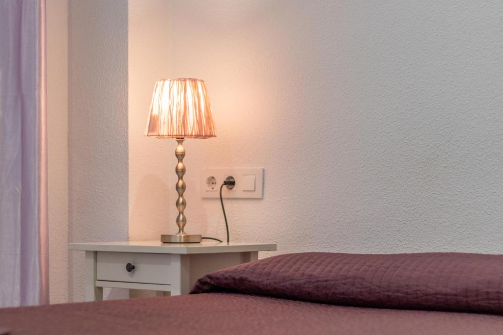 Posteľ alebo postele v izbe v ubytovaní Altea Villa Buraux , Apartamento con vistas al mar & parking en el corazón del casco viejo de Altea