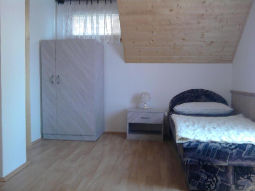 Postel nebo postele na pokoji v ubytování Lomb Nyaraló