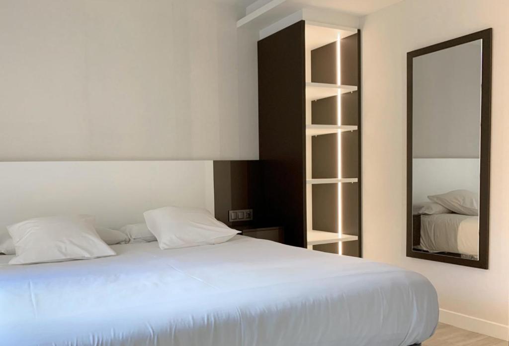 Postel nebo postele na pokoji v ubytování Hotel Remigio