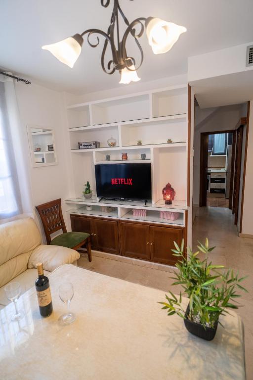 Televízia a/alebo spoločenská miestnosť v ubytovaní Luxury Ronda Center