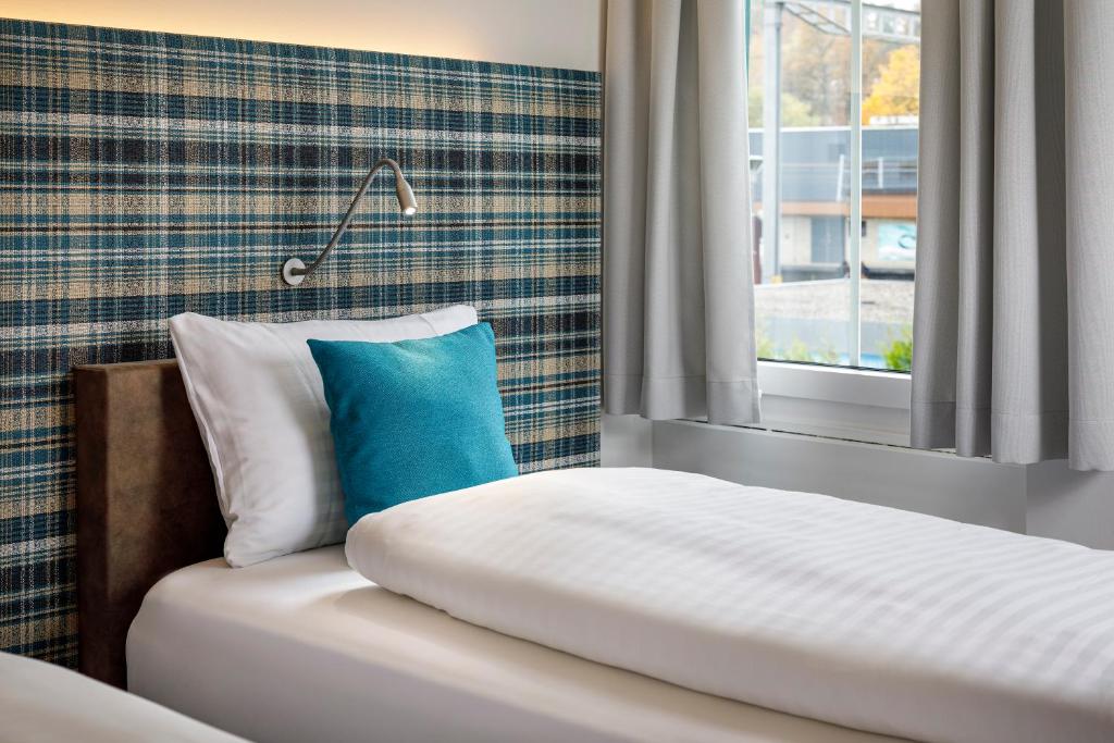 Postel nebo postele na pokoji v ubytování Hotel Schweizerhof