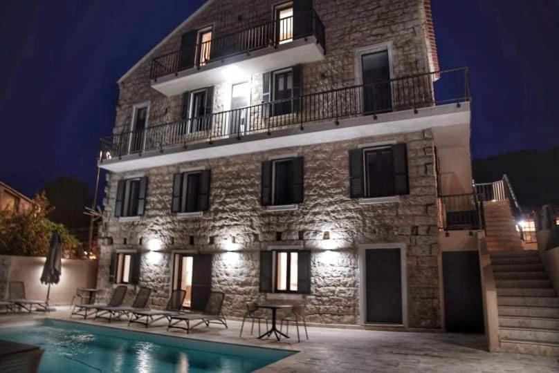 a building with a swimming pool in front of it at A PIANARELLA in San-Gavino-di-Carbini