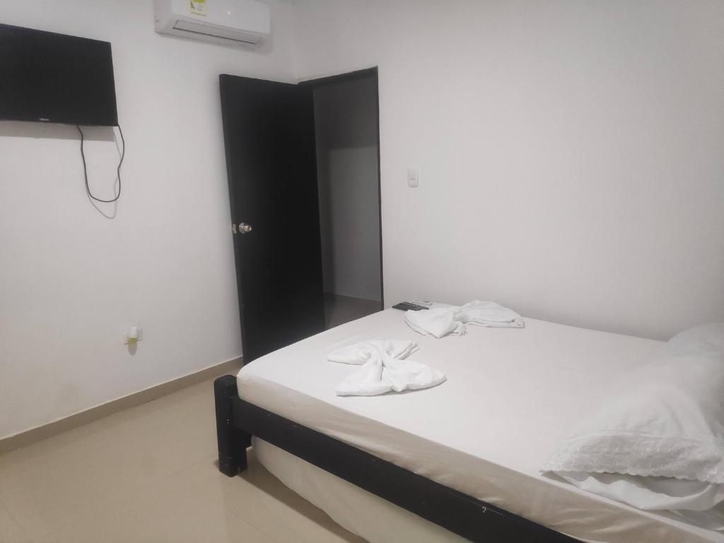 Postel nebo postele na pokoji v ubytování Apartamentos Villa Leonor