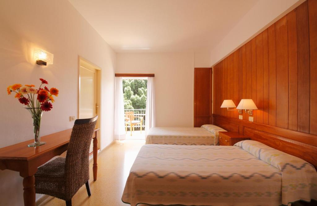 מיטה או מיטות בחדר ב-Hotel Edén