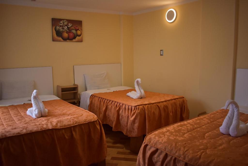 Postel nebo postele na pokoji v ubytování SUMAQ PUNO