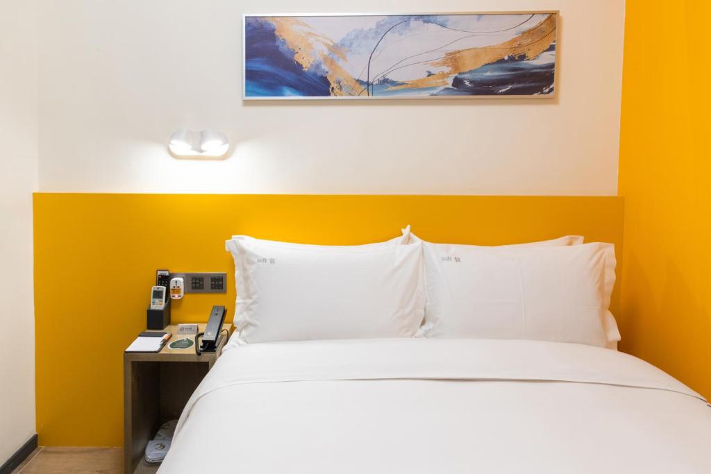 Postel nebo postele na pokoji v ubytování City Inn Macau