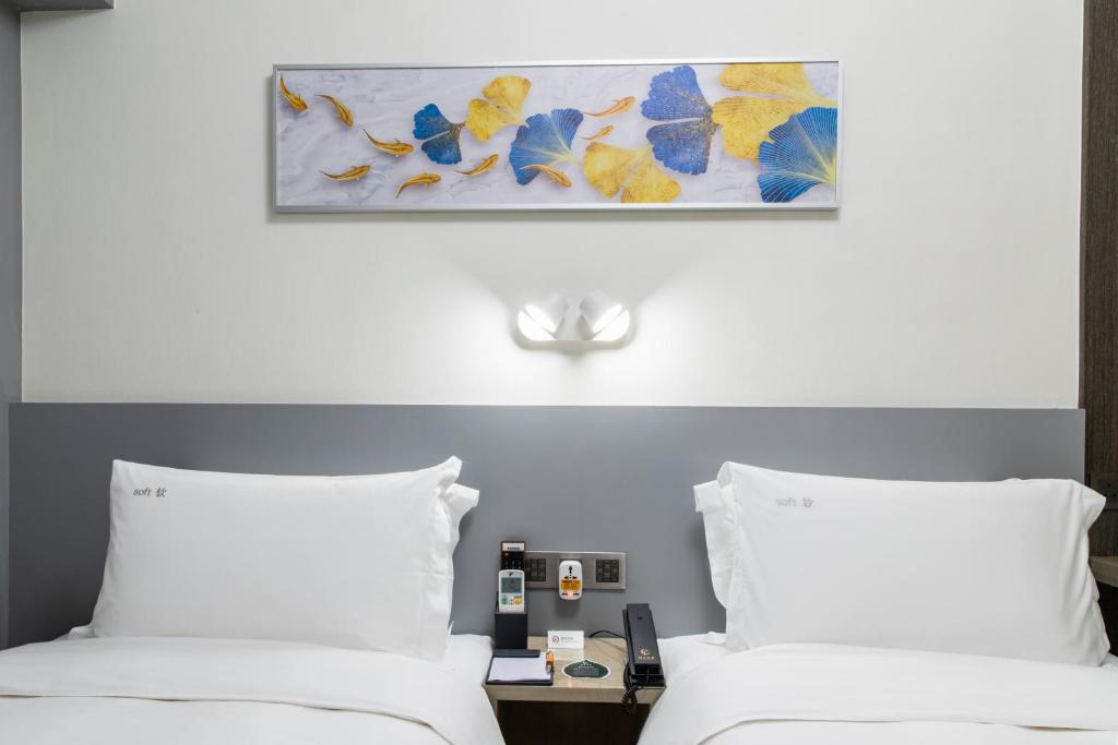 Postel nebo postele na pokoji v ubytování City Inn Macau