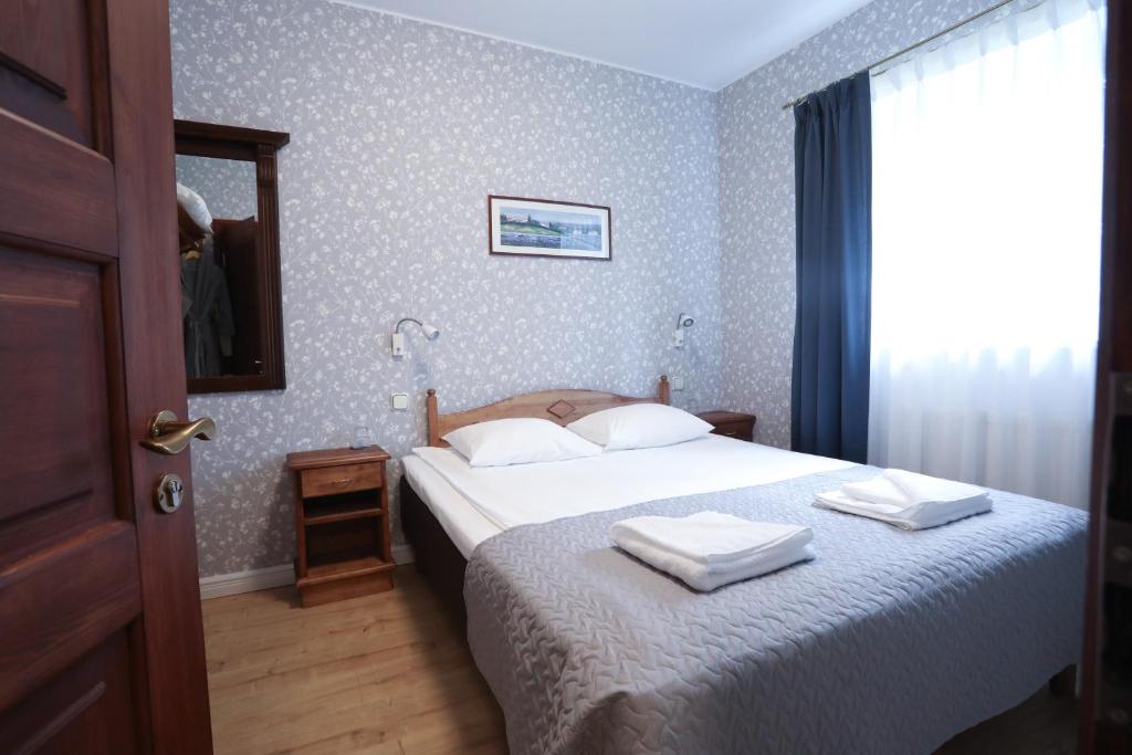 Postel nebo postele na pokoji v ubytování Saka Manor