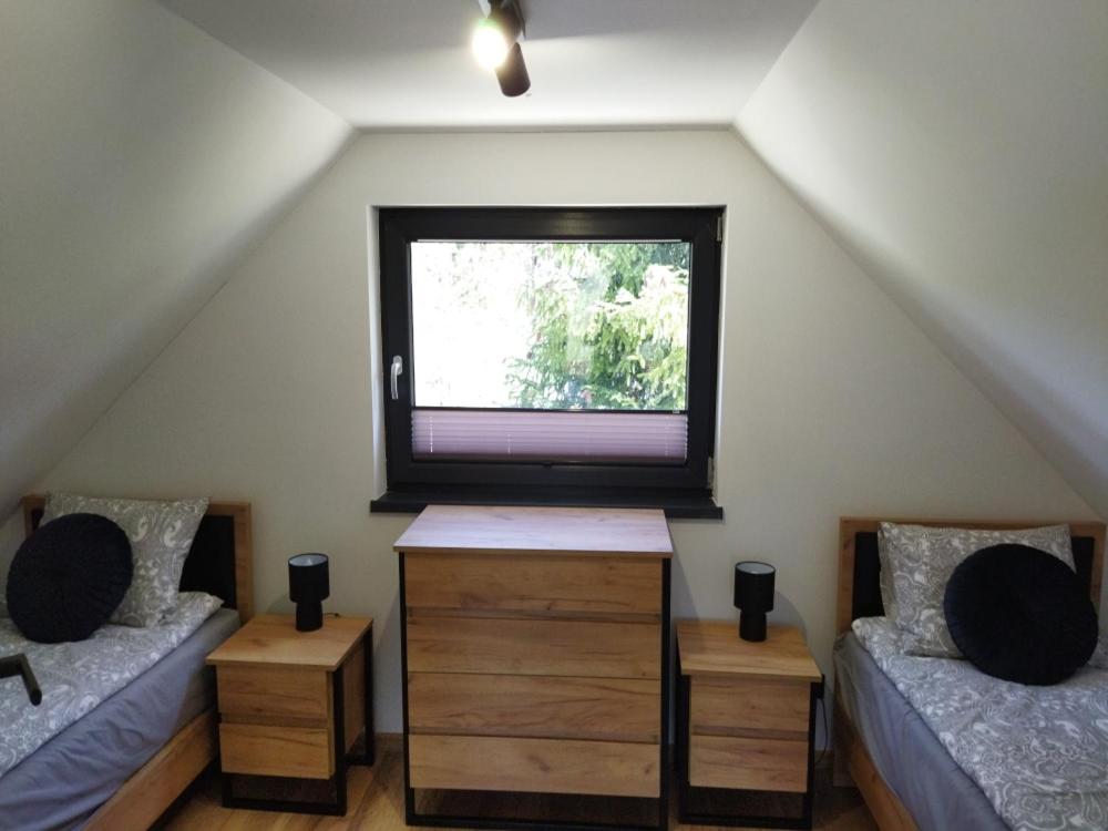 Postel nebo postele na pokoji v ubytování Chatki wisla houses