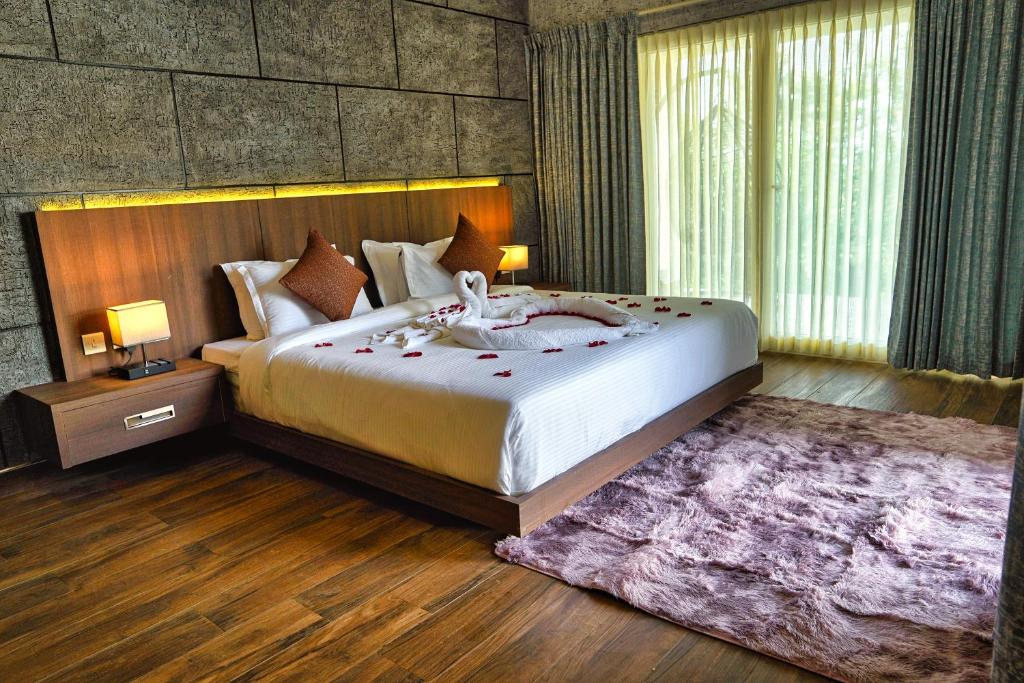 Postel nebo postele na pokoji v ubytování Jungle Bay Resorts & Spa