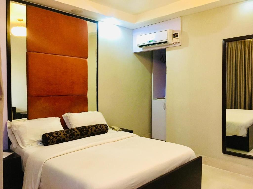 Postel nebo postele na pokoji v ubytování BW Starfire Hotel