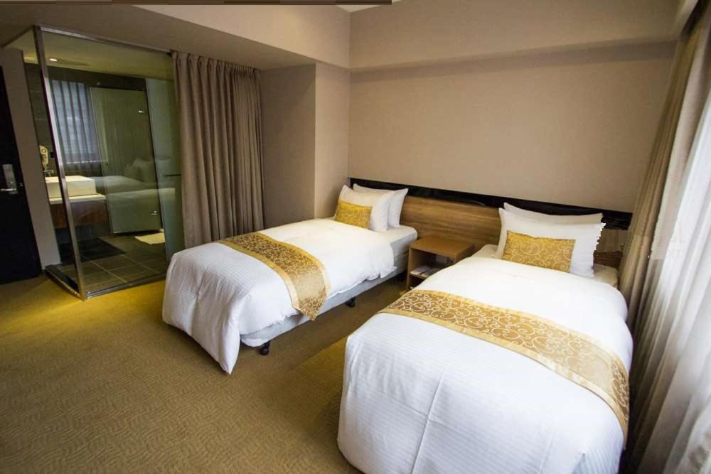 Postel nebo postele na pokoji v ubytování City Hotel
