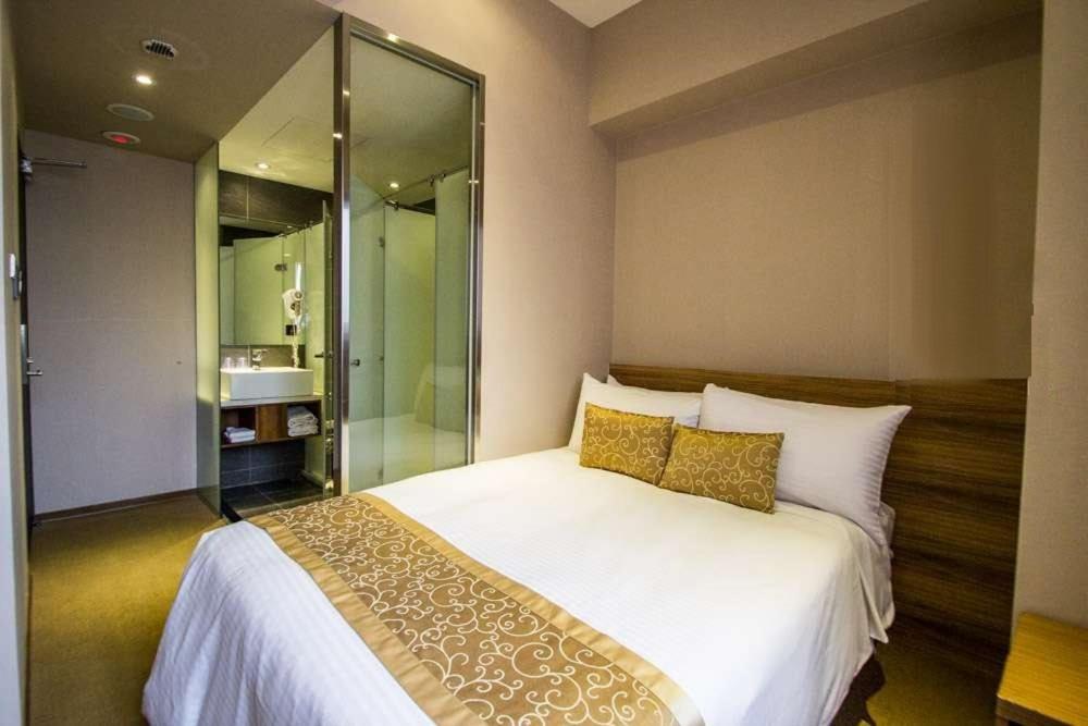 Postel nebo postele na pokoji v ubytování City Hotel
