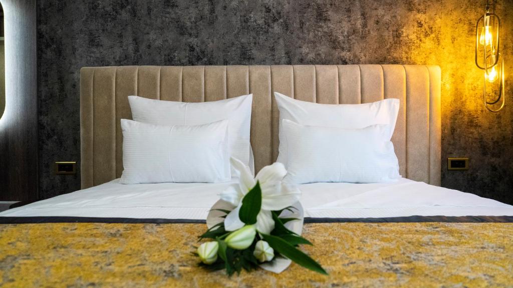 Postel nebo postele na pokoji v ubytování Hotel Pasha