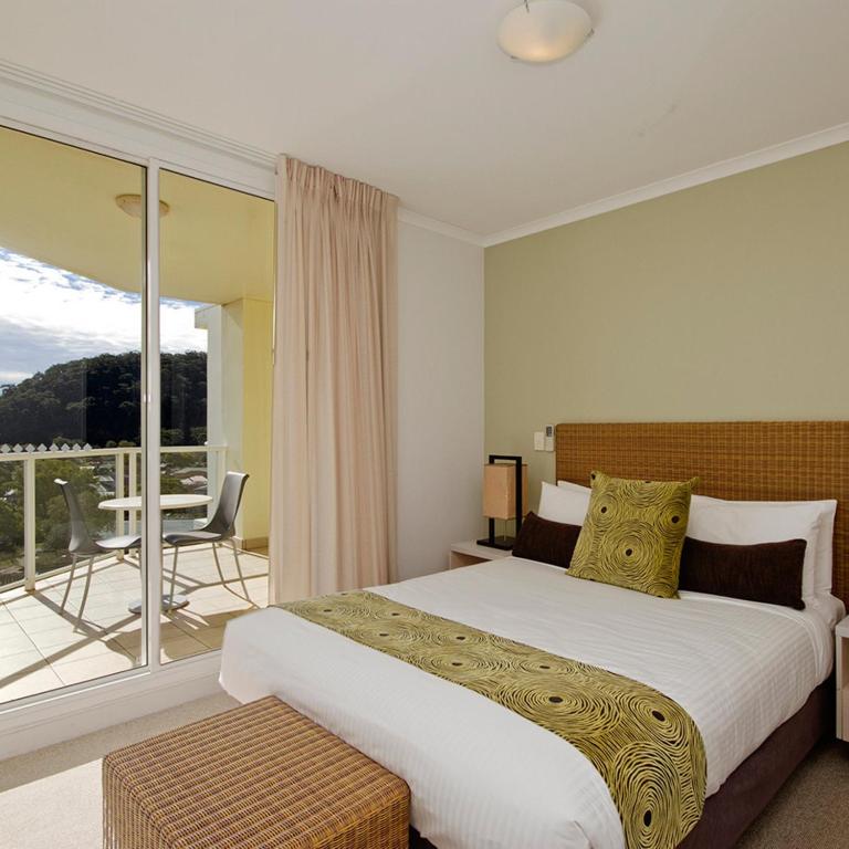 Letto o letti in una camera di Mantra Ettalong Beach