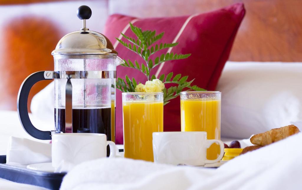 two glasses of orange juice and two cups of coffee at The Parkgate Hotel in Cardiff